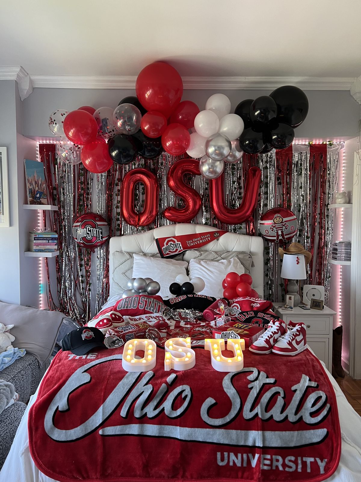 Ohio State bed party with OSU balloon letters, red and black balloons, LED OSU letters, and extensive Buckeyes merchandise